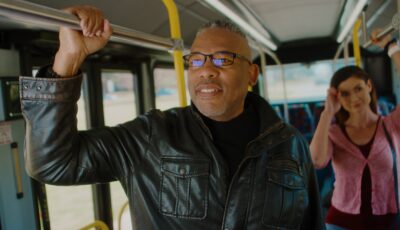 People happily riding the bus